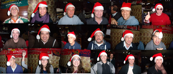 os 18 bttistas com barretes de pai natal durante o jantar
